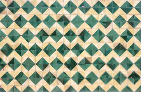 Aged green and cream mosaic wall