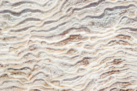 Background textural of asymmetric drawing. Natural texture of travertine Pamukkale. Close-up