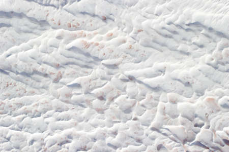 Background white and grey texture of Pamukkale calcium travertine in Turkey, abstract pattern, top...