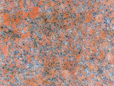 Red granite texture, background or wallpaper. Polished face stone texture.の写真素材