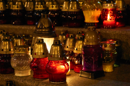 Memorial candles on the steps of the church and the cemetery. All Souls' Day, Commemoration of All the Faithful Departed, prayer for the dead, 2nd November.の写真素材