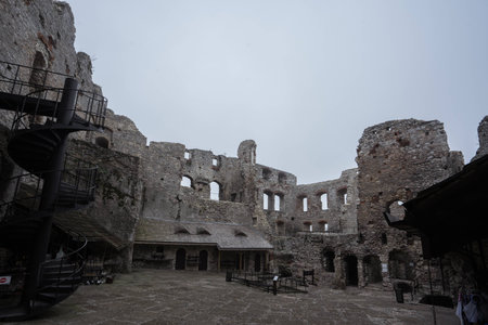 courtyard of medieval castle ruin in bad weatherの写真素材