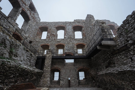 windows and room remain of medieval castle ruin in bad weatherの写真素材