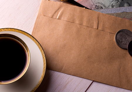 Breakfast, coffee and letter with some old moneyの写真素材