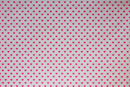 Gift wrapping paper with red hearts, backgroundの写真素材
