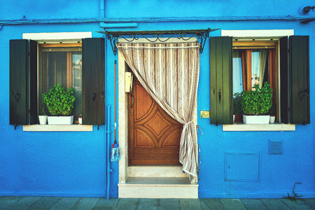 Front of the blue house on the island of Burano. Italy, Venice. Tonedの写真素材