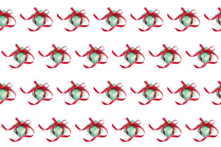 Seamless pattern. A green gift box with a red ribbon and a bow on white background.