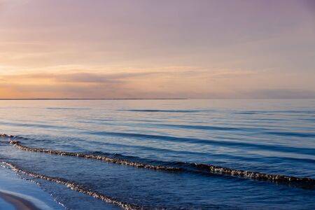 Beautiful light sunset over Baltic sea. Natural background. Latvia. Afterglow, evening calm on the Seaの写真素材