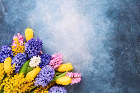 Spring flowers bouquet on a bright blue background. Mothers day, Valentines Day, Birthday celebration concept.の写真素材