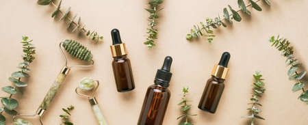 Facial green jade roller, dark brown glass dropper bottles for medical and cosmetic use, and...