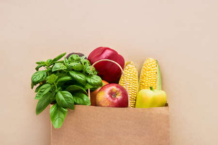 Healthy vegetarian food in paper bag vegetables and fruits. Food shopping concept. Copy space, flat...