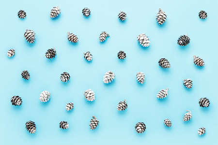 Abstract background. Small silver cones on a blue background. Top view