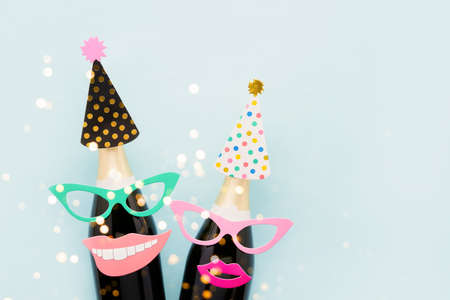 Carnival background. Party props and champagne on a light blue background. Holiday concept, purimの写真素材