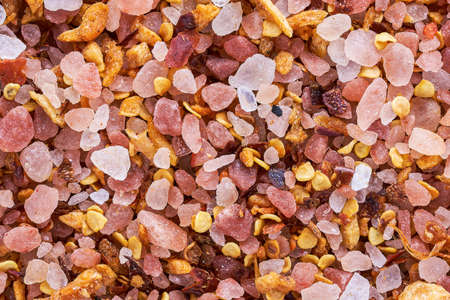 Himalayan pink salt with garlic and pepper. Food background.の写真素材