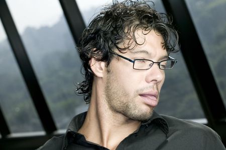 Man with glasses making funny expressionの写真素材