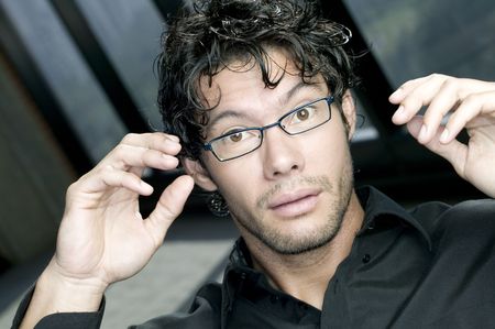 Worried young man making weird expressionの写真素材