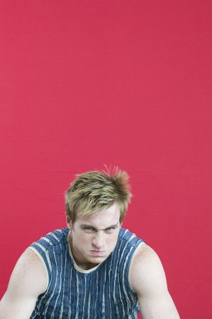 young man red bakgroundの写真素材