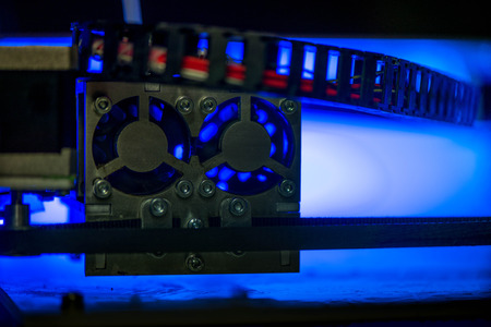 Working with 3D printer in the laboratory and studying technology. Printer is heating up. Macro shot...