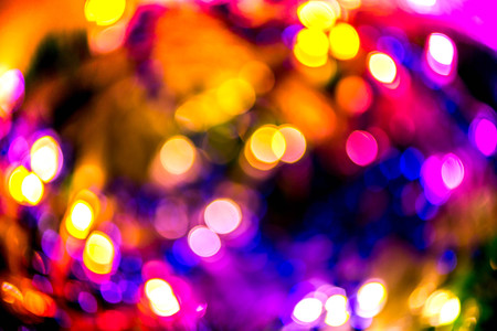 Abstract, blurry, vibrant and colorful background. A shot of Christmas decorations and lights on a...