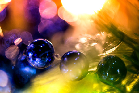Abstract, blurry, vibrant and colorful background. A shot of Christmas decorations on a Christmas Treeの写真素材
