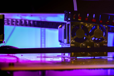 Working with 3D printer in the laboratory and studying technology. Printer is heating up. Macro shot...