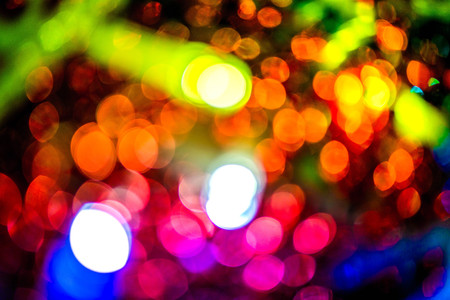 Abstract, blurry, vibrant and colorful background. A shot of Christmas decorations and lights on a...