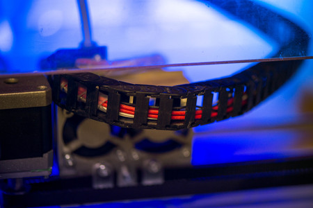 Working with 3D printer in the laboratory and studying technology. Printer is heating up. Macro shot...
