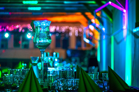 New years celebration, Luxuriously made tables. Music, romantic lights, champagne and wine. People are having fun. Holidays, vacation, party, fun, drinks, perfect mood to party hard all night long.の写真素材