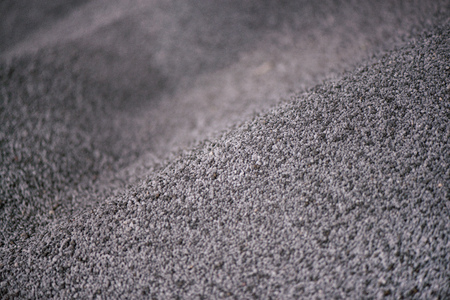 Shot of mixed chemical, artificial nitrogen plant fertilizer granules in factory. Big heaps of mineral pellets creating abstract textures, patterns. Minerals used in agriculture, farms, fieldsの写真素材