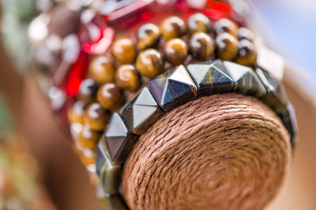 Gemstone bracelets and necklaces in a row. Jewelry made of heliotrope stone, crystals, moonstone and sugilite blue stone. Healing, powerful crystal energy. Esoteric and colorful backgroundの写真素材