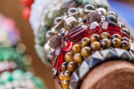 Gemstone bracelets and necklaces in a row. Jewelry made of heliotrope stone, swarovski crystals, moonstone and sugilite blue stone. Healing, powerful crystal energy. Esoteric and colorful background.の写真素材