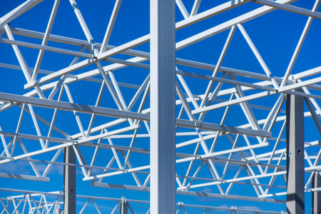 Industrial construction site of new commercial shopping mall in a city center. Reinforced concrete piles foundation for the building. Ongoing framing and construction of a factory. Construction workerの写真素材