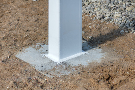 Industrial construction site of new shopping mall in a city. Reinforced concrete piles foundation for the building. Freshly made grouting base pole for block buildingの写真素材