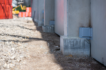 Industrial construction site of new shopping mall in a city. Reinforced concrete piles foundation for the building. Freshly made grouting base pole for block buildingの写真素材