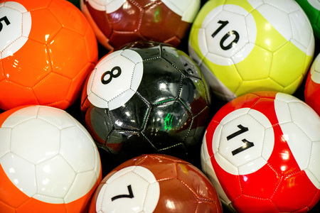 Shot of foot pool balls standing on green table. Foot Pool is the hybrid combination of pool and...