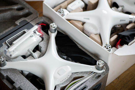 Two brand new unboxed drones in carry boxes. Concept of rapid technology development and comparing...