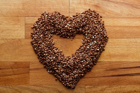 heart of buckwheat on a wooden backgroundの写真素材