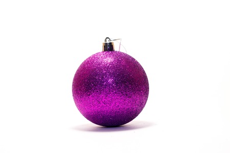 Christmas toy ball filled with tinsel on white backgroundの写真素材