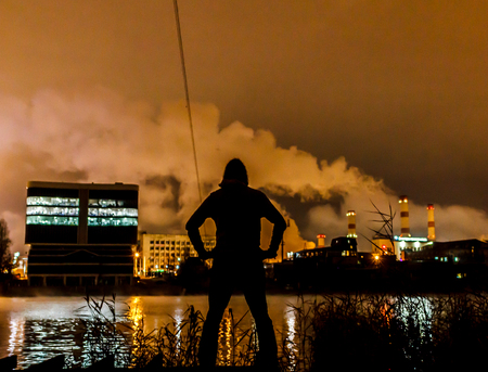 against the backdrop of an industrial cityの写真素材