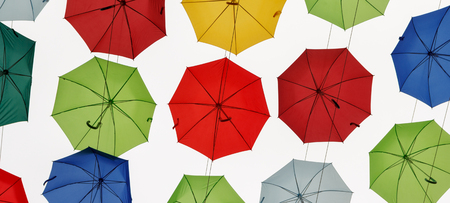 beautiful, colored and multicolored umbrellas in the skyの写真素材