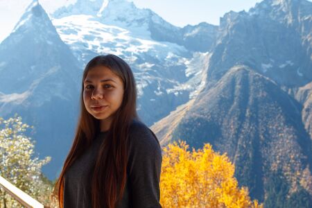 A little traveler against the backdrop of the mountainsの写真素材
