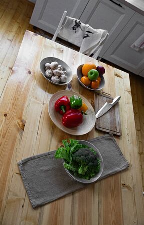 Fresh farmers tomatoes and basil on wood table.の写真素材
