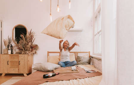 bright bedroom morning light from the windowsの写真素材