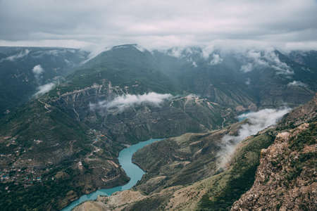 Dagestan traditional highland village Danukh with green terraces in Caucasus Mountains. Rural mountain scenery in Russiaの写真素材