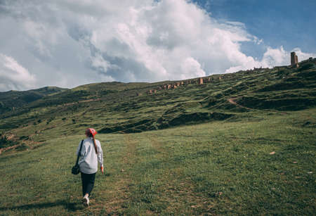 Pretty girl on peak mountain with perfect view.の写真素材