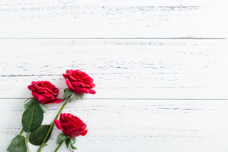 Red roses on a wooden backgroundの写真素材