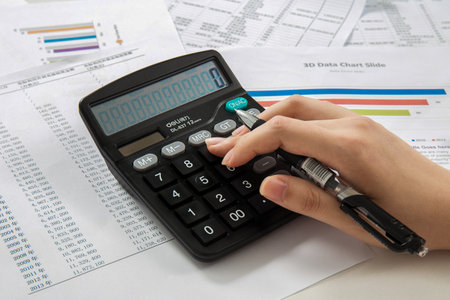Accountants Use Computers To Calculate Accounts On The Tableの写真素材