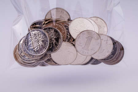 Commercial And Financial Coins on a white backgroundの写真素材