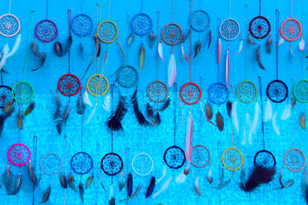 Colorful Dream Catchers over blue background. Abstract colorful background. Dream Catchers, hand...