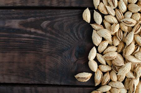 Almonds background with copyspace. Top view.